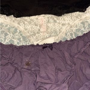 Women’s panties by Victorias Secret. A purple pair, a white and a black